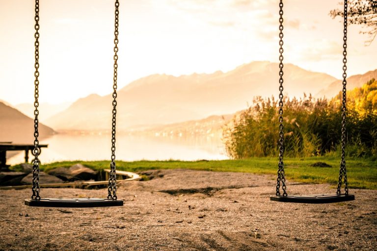 two empty swings at park